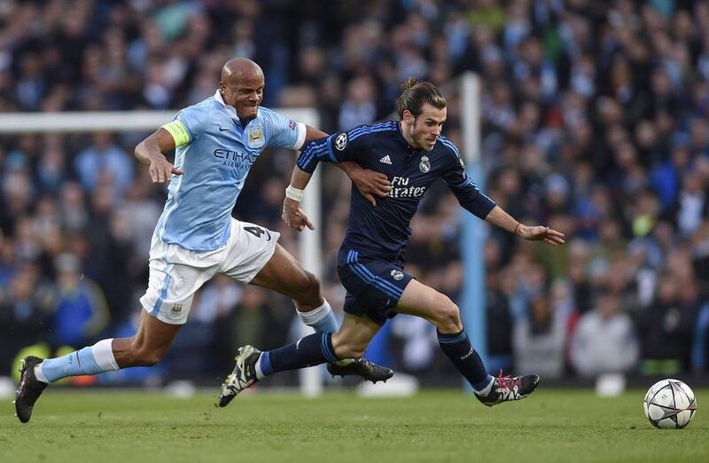 Gareth Bale of Real Madrid in action against Vincent Kompany of Mancester City. Peter Powell / EPA
