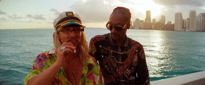 This image released by Neon shows Matthew McConaughey, left, and Snoop Dogg in a scene from "The Beach Bum." (Neon via AP)