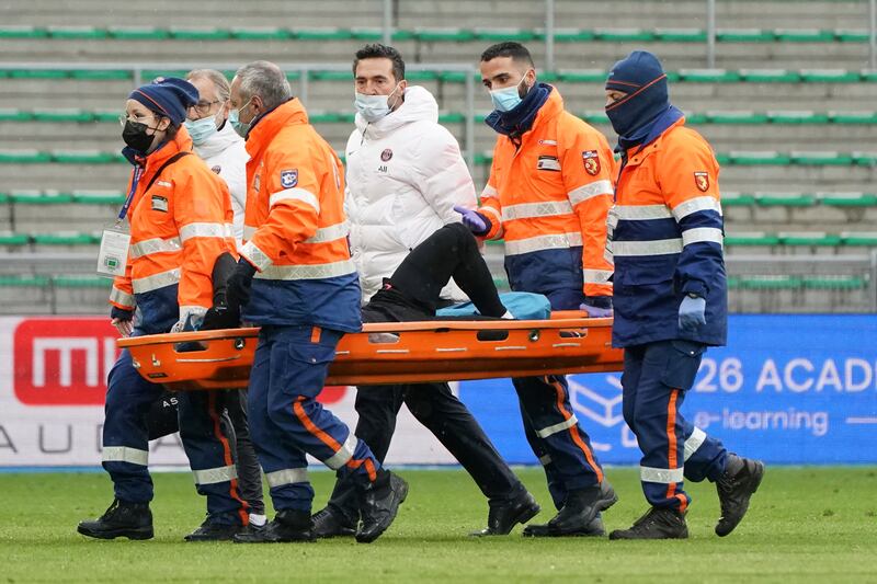 Injured PSG attacker Neymar is carried off the pitch. AP