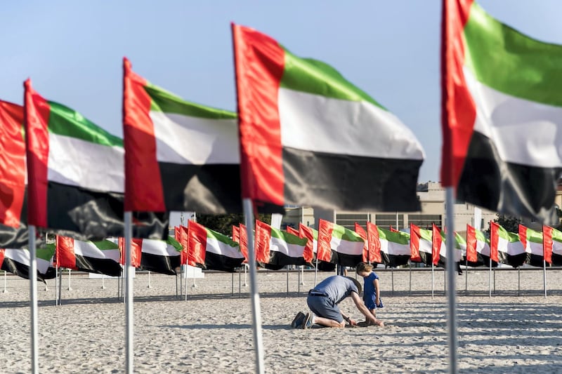 DUBAI, UNITED ARAB EMIRATES - NOVEMBER 29, 2018. 

A father and his daughter play at Flag Garden on Kite Beach.

(Photo by Reem Mohammed/The National)

Reporter: 
Section:  NA POAN