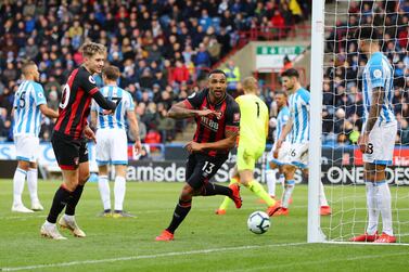 Callum Wilson celebrates after scoring the first goal in Bournemouth's 2-0 win at Huddersfield Town. Getty