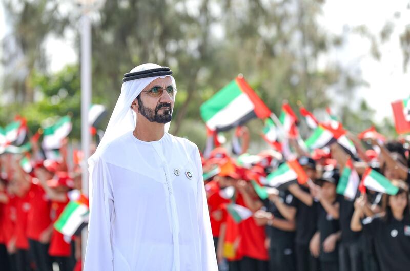 Mohammed bin Rashid raises the flag of the UAE in the Union House. WAM