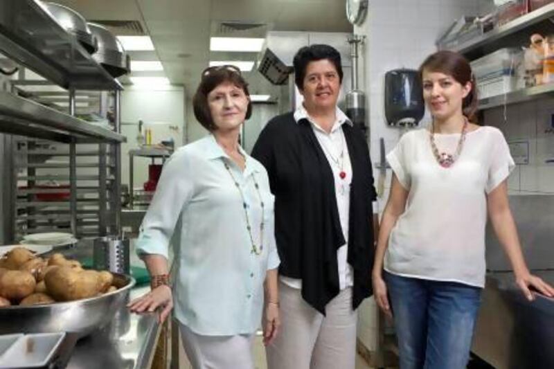 The Dubai chapter of the Slow Food movement was founded by Laura Allais-Maré, centre, seen here with media coordinator Sherry Bohlen, left, and co-founder and event planner Joanna Jarosz at Baker and Spice in Souq Al Manzil, Dubai. Antonie Robertson / The National