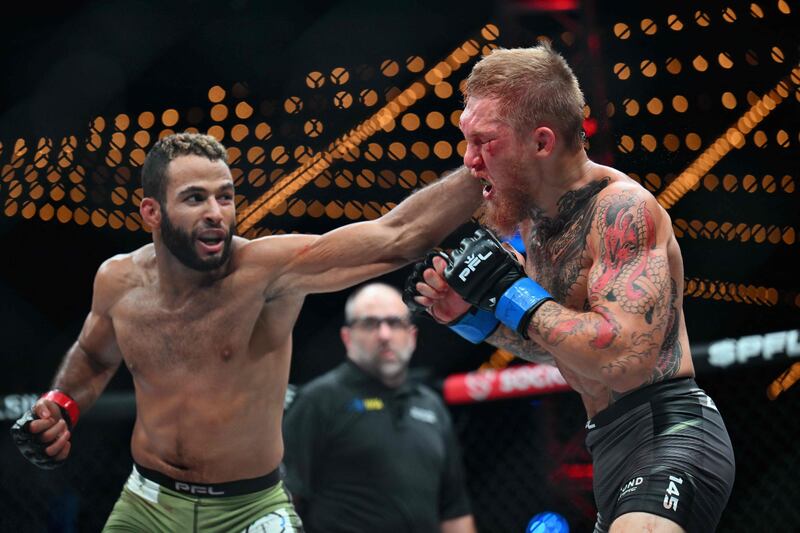 Saudi fighter Abdullah Al Qahtani, left, and American David Zelner compete during the Professional Fighters League 2023 playoffs featherweight fight in New York. AFP