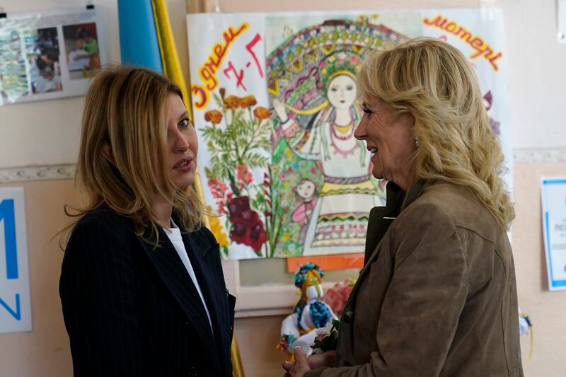 Ms Biden talks to Ms Zelenska at the end of their visit to a public school that has taken in displaced pupils in Uzhhorod, Ukraine. AP