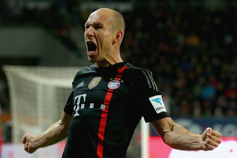 Bayern Munich's Arjen Robben celebrates scoring the second goal of his side's Bundesliga victory against Augsburg on Saturday. Alexander Hassenstein / Bongarts / Getty Images / December 13, 2014 