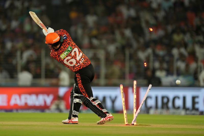 Sunrisers Hyderabad's Travis Head is bowled out by Kolkata Knight Riders' Mitchell Starc for a duck. AP