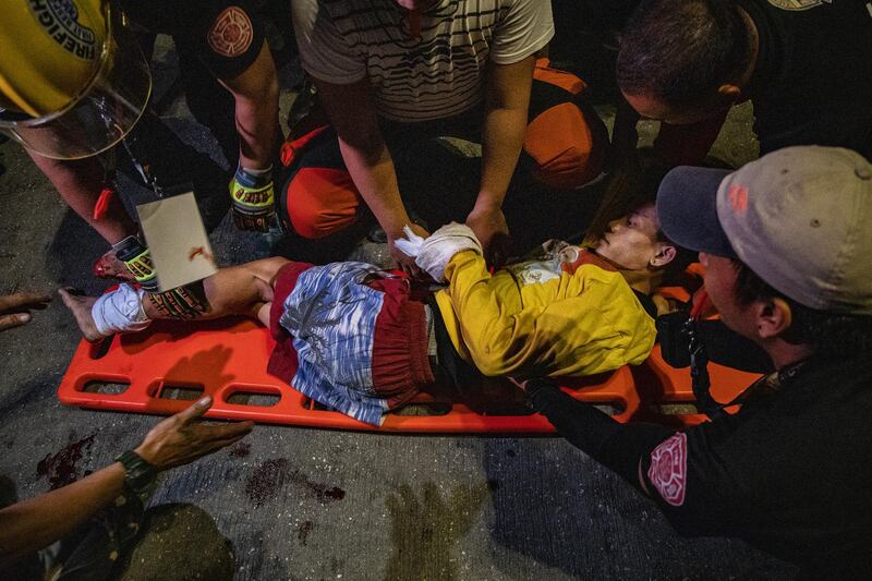 A Filipino Catholic devotee is carried onto a stretcher after he was injured while taking part in the annual procession of the Black Nazarene. Getty
