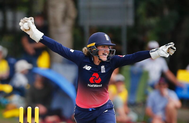 England's Sarah Taylor celebrates after running out Australia's Elyse Villani  during the Women's One Day International between Australia and England at Allan Border Field in Brisbane, Australia. Jason O'Brien / Getty Images
