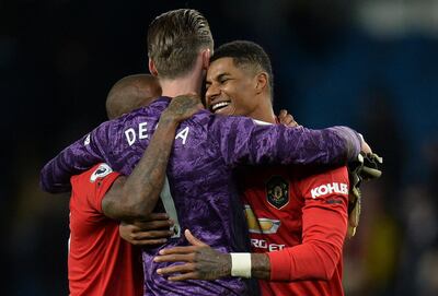 epa08052987 Manchester United's Marcus Rashford (R) and David de Gea (C) react after the English Premier League soccer match between Manchester United and Manchester City held at the Etihad Stadium, Manchester, Britain 07 December 2019.  EPA/PETER POWELL EDITORIAL USE ONLY. No use with unauthorized audio, video, data, fixture lists, club/league logos or 'live' services. Online in-match use limited to 120 images, no video emulation. No use in betting, games or single club/league/player publications