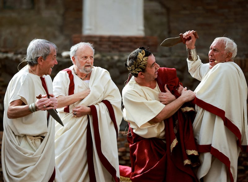 Members of Roman historical society 'Gruppo Storico Romano' take part in a re-enactment of the 'Ides of March', also known as the date on which Julius Caesar was assassinated in 44 BC, in the archaeological area of Largo Argentina in Rome, Italy March 15, 2024.  REUTERS / Yara Nardi     TPX IMAGES OF THE DAY