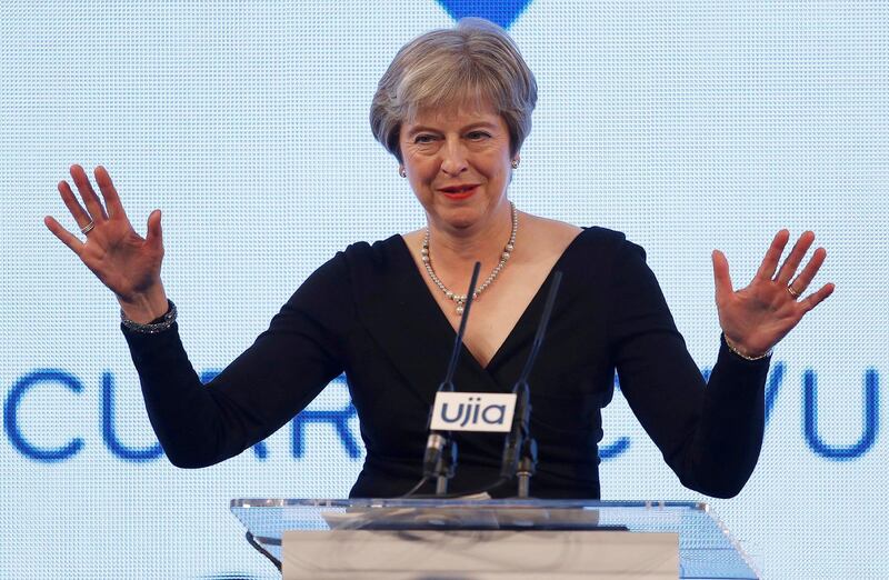 Britain's Prime Minister Theresa May gestures as she speaks at the United Jewish Israel Appeal charity dinner in London, Monday Sept. 17, 2018. (Peter Nicholls/Pool via AP)