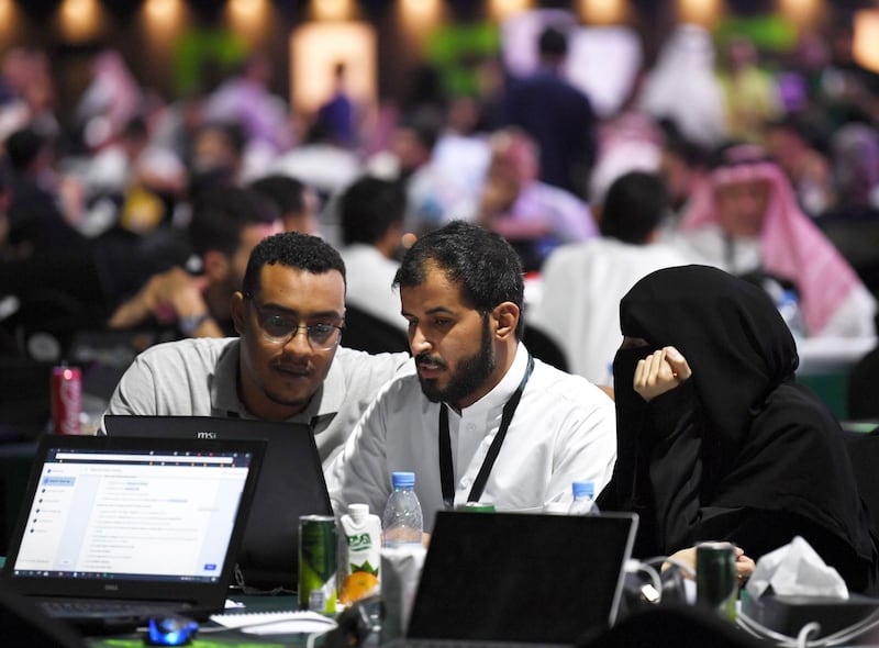 Participants including Saudi women attend a hackathon in Jeddah on August 1, 2018, prior to the start of the annual Hajj pilgrimage in the holy city of Mecca.
Around 3,000 participants attended the three-day "Hackathon event" in Jeddah, the government said, with the aim of exploring high-tech solutions to make Hajj pilgrimage more efficient and safe. / AFP PHOTO / Amer HILABI