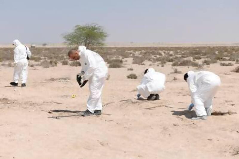 Abu Dhabi Police found a severed human head in Al Samha area. A headless body was discovered buried in the sand next to it. Courtesy Security Media