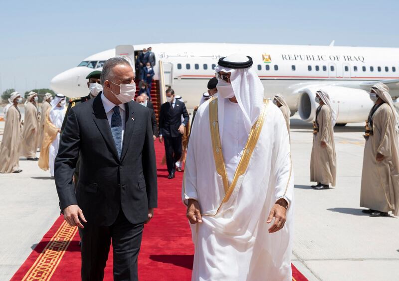 A handout image provided by United Arab Emirates News Agency (WAM) on April 4, 2021 shows Sheikh Mohamed bin Zayed al-Nahyan (R), Crown Prince of Abu Dhabi and Deputy Supreme Commander of the UAE Armed Forces, welcoming Iraq's Prime Minister Mustafa al-Kadhemi upon his arrival in Abu Dhabi.  - === RESTRICTED TO EDITORIAL USE - MANDATORY CREDIT "AFP PHOTO / HO / WAM" - NO MARKETING NO ADVERTISING CAMPAIGNS - DISTRIBUTED AS A SERVICE TO CLIENTS ===
 / AFP / WAM / - / === RESTRICTED TO EDITORIAL USE - MANDATORY CREDIT "AFP PHOTO / HO / WAM" - NO MARKETING NO ADVERTISING CAMPAIGNS - DISTRIBUTED AS A SERVICE TO CLIENTS ===
