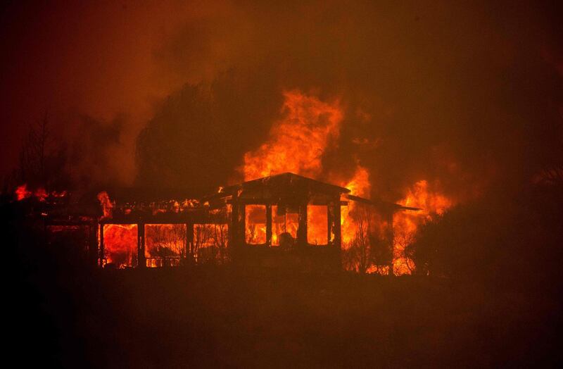 A house burns during the Mendocino Complex fire near Finley, California. AFP PHOTO / JOSH EDELSON