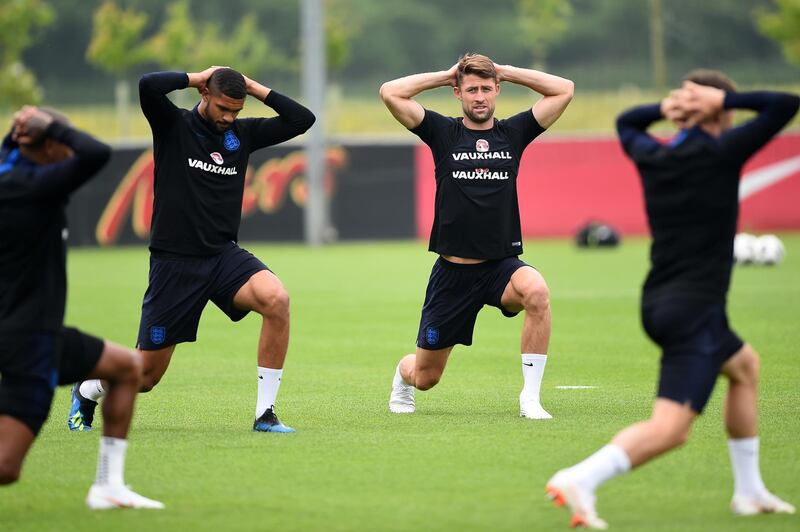 Ruben Loftus-Cheek and Gary Cahill warm up during a training session at St Georges Park on May 28, 2018 in Burton-upon-Trent, England. Nathan Stirk / Getty Images