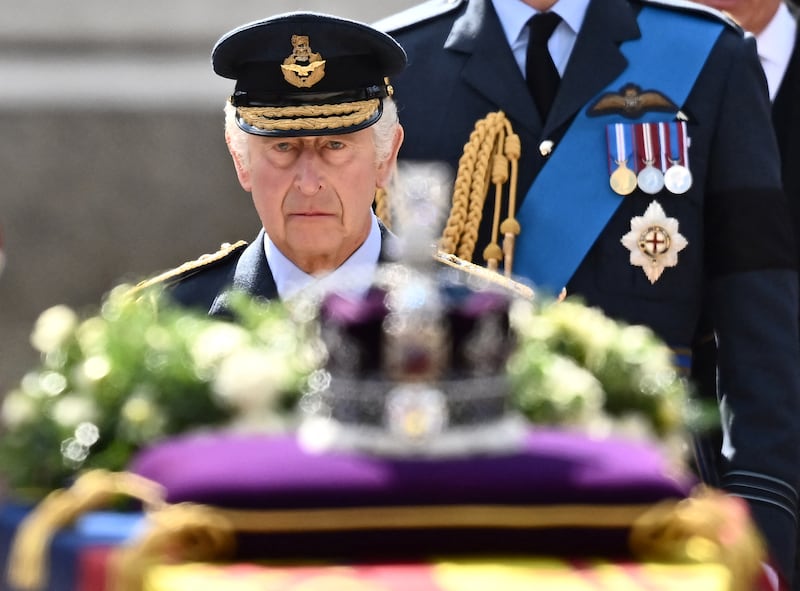 King Charles walks behind the coffin of Queen Elizabeth during a procession from Buckingham Palace to the Palace of Westminster. AFP