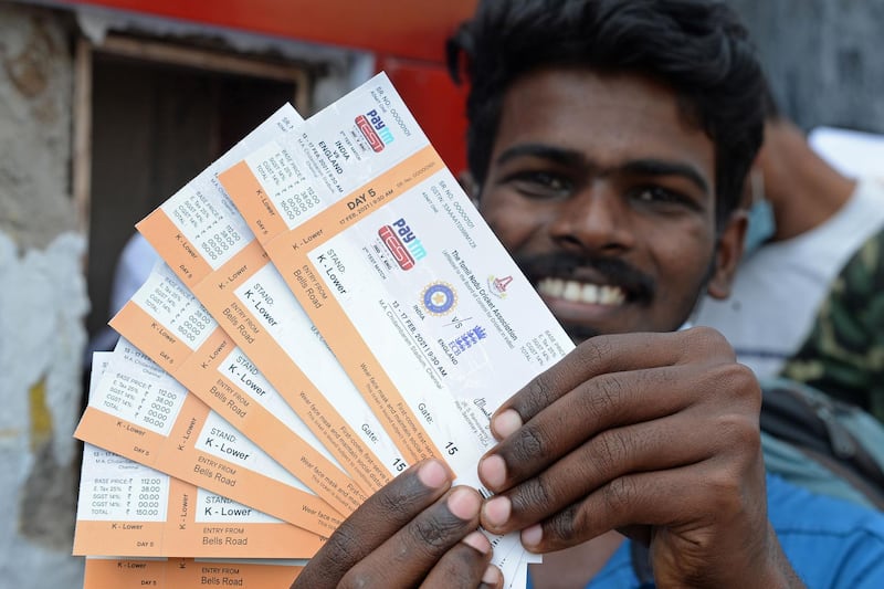 A fans shows his tickets for the Chennai Test. AFP