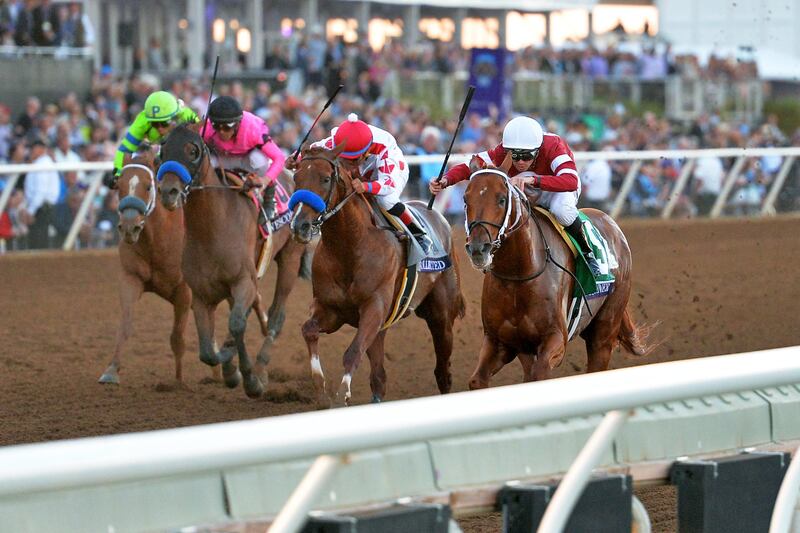 Nov 4, 2017; Del Mar, CA, USA; Gunner Runner (right) leads Collected (middle right) and West Coast (middle left) and War Story (left) to the finish line for the win in the 12th race during the 34th Breeders Cup world championships at Del Mar Thoroughbred Club. Mandatory Credit: Jake Roth-USA TODAY Sports