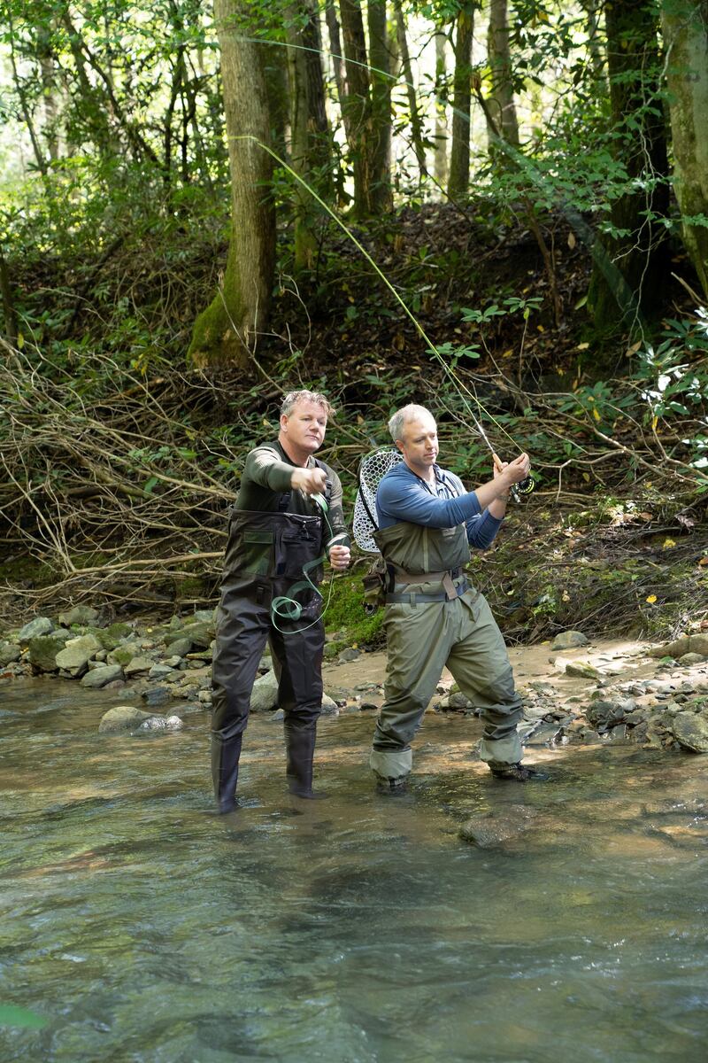 NC - Gordon Ramsay (L) and chef, William Dissen, discuss community, food culture and cuisine while fly fishing in the Great Smoky Mountains of North Carolina. (Credit: National Geographic/Justin Mandel)