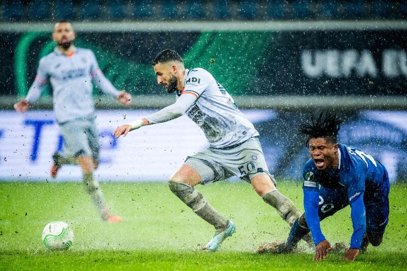 Basaksehir's Algerian defender Ahmed Touba fights for the ball with Gent's Nigerian forward Gift Emmanuel Orban in their Europa Conference League last 16 match in the Belgian town. AFP
