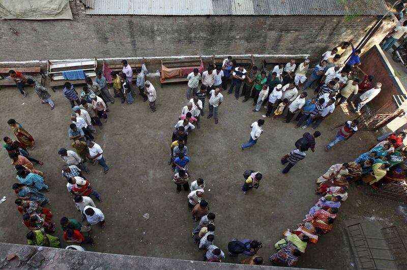 Voters line up to cast their votes outside a polling station at Howrah district in the eastern Indian state of West Bengal. Rupak De Chowdhuri / Reuters