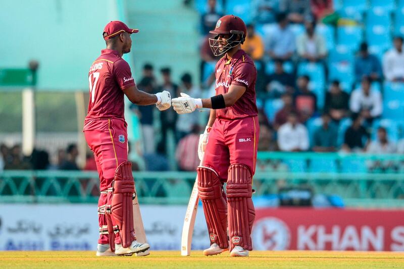 West Indies' Shai Hope (R) and Evin Lewis (L) touch their gloves during the second one day international (ODI) cricket match between Afghanistan and West Indies at the Ekana Cricket Stadium in Lucknow on November 9, 2019. ----IMAGE RESTRICTED TO EDITORIAL USE - STRICTLY NO COMMERCIAL USE-----
 / AFP / Rohit UMRAO / ----IMAGE RESTRICTED TO EDITORIAL USE - STRICTLY NO COMMERCIAL USE-----
