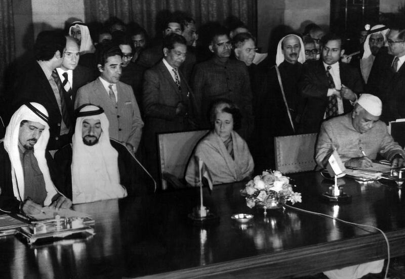 Founding Father Sheikh Zayed and Indira Gandhi, former prime minister of India, witness the signing of a cultural agreement in 1975. National Archives image