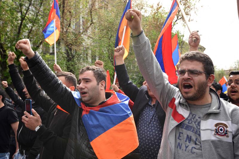 Demonstrators shout slogans during the anti-government rally held in Yerevan. AFP