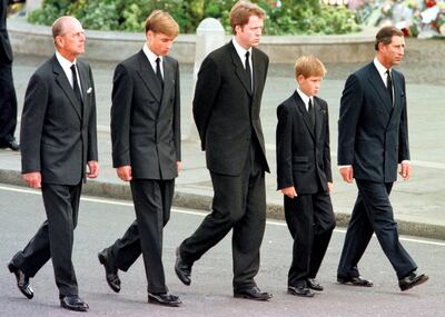 (L to R) The Duke of Edinburgh, Prince William, Earl Spencer, Prince Harry and Prince Charles walk outside Westminster Abbey during the funeral service for Diana, Princess of Wales, 06 September. Hundreds of thousands of mourners lined the streets of Central London to watch the funeral procession. The Princess died last week in a car crash in Paris. / AFP PHOTO / RTR/WPA POOL / JEFF J. MITCHELL