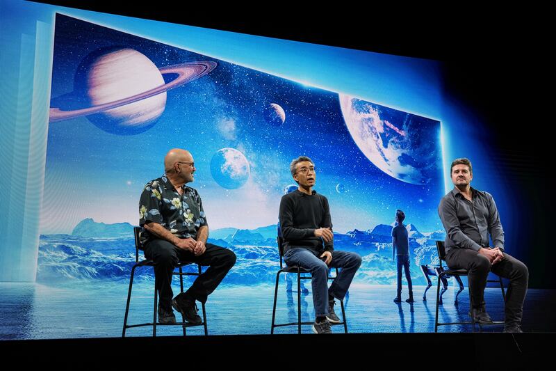 From left, Boston Dynamics founder and chairman Marc Raibert, Hyundai Motors' TaaS Division president Chang Song and Microsoft's cloud and AI vice president Ulrich Homann take part in a media conference at CES 2022. AP