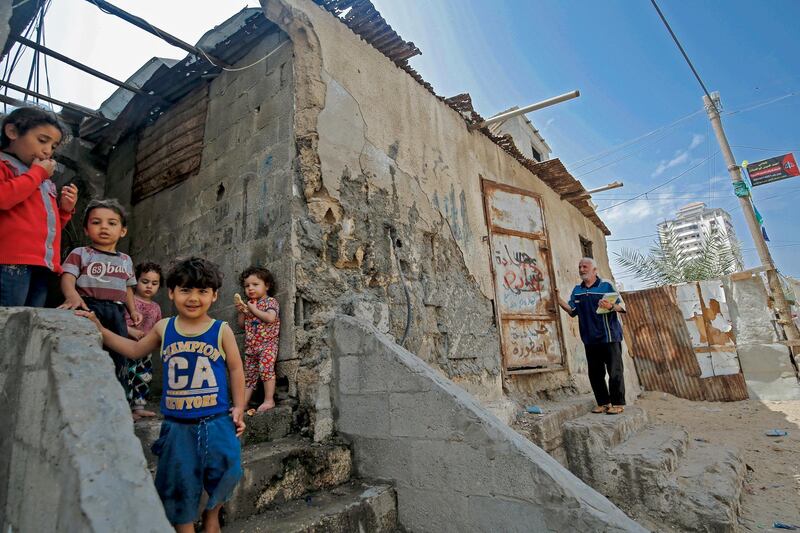 Palestinian children are pictured outside their shacks in Gaza City's Al-Shati refugee camp on May 15, 2020, as Palestinians marked the 72nd anniversary of "Nakba" (Day of Catastrophe) due to the COVID-19 coronavirus pandemic. - The "Nakba" commemorates the mass displacement of more than 700,000 Palestinians who fled or were expelled from their homes in the 1948 war surrounding Israel's creation. (Photo by MOHAMMED ABED / AFP)