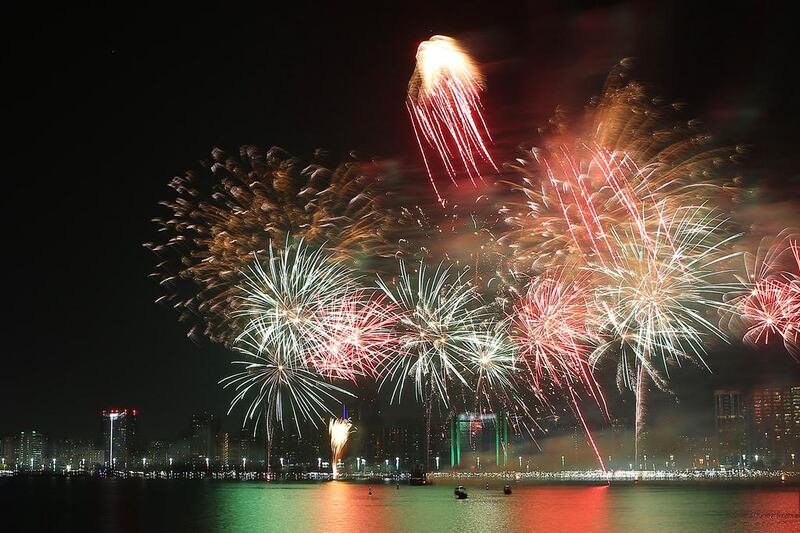 Fireworks explode in the night sky along the Corniche in celebration of the 45th National Day in Abu Dhabi. Delores Johnson / The National