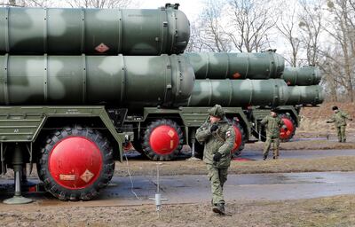 FILE PHOTO: Russian servicemen stand next to a new S-400 "Triumph" surface-to-air missile system after its deployment at a military base outside the town of Gvardeysk near Kaliningrad, Russia March 11, 2019. Picture taken March 11, 2019. REUTERS/Vitaly Nevar/File Photo