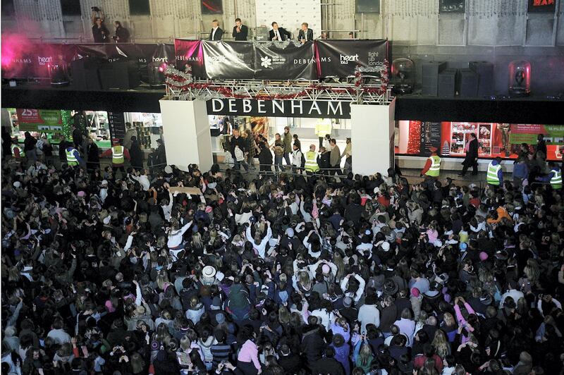 LONDON - NOVEMBER 15:  Irish group Westlife flick the switch at the annual ceremony turning on the Oxford Street Christmas Lights, at Debenhams Oxford Street on November 15, 2005 in London, England.  This year's lights raise funds for Great Ormond Street, Breast Cancer Campaign and Centrepoint charities, with stars including Jamie Cullum, Sugababes and Daniel Bedingfield urging members of the public to sponsor lightbulbs at GBP5 each along the famous West End shopping parade.  (Photo by MJ Kim/Getty Images)