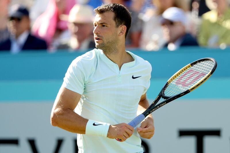 LONDON, ENGLAND - JUNE 21:  Grigor Dimitrov of Bulgaria returns a shot during his men's singles match aganst Novak Djokovic of Serbia on Day Four of the Fever-Tree Championships at Queens Club on June 21, 2018 in London, United Kingdom.  (Photo by Matthew Stockman/Getty Images)