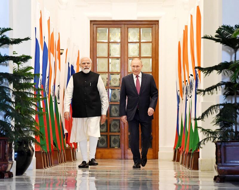Mr Modi escorts Mr Putin to their summit talks at Hyderabad House in New Delhi. AFP