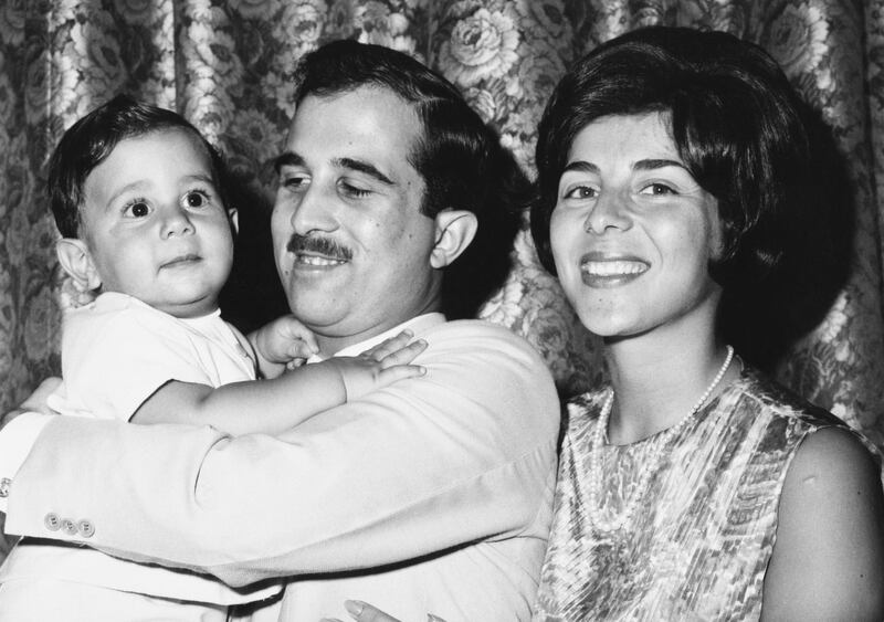 Princess Firyal of Jordan with Prince Muhammad bin Talal holding their son Prince Talal bin Muhammad on his first birthday, 26th July 1966. (Photo by Hulton Archive/Getty Images)
