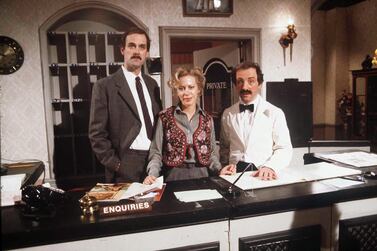 John Cleese, Connie Booth and Andrew Sachs in an episode of 'Fawlty Towers'. Photo by Shutterstock 