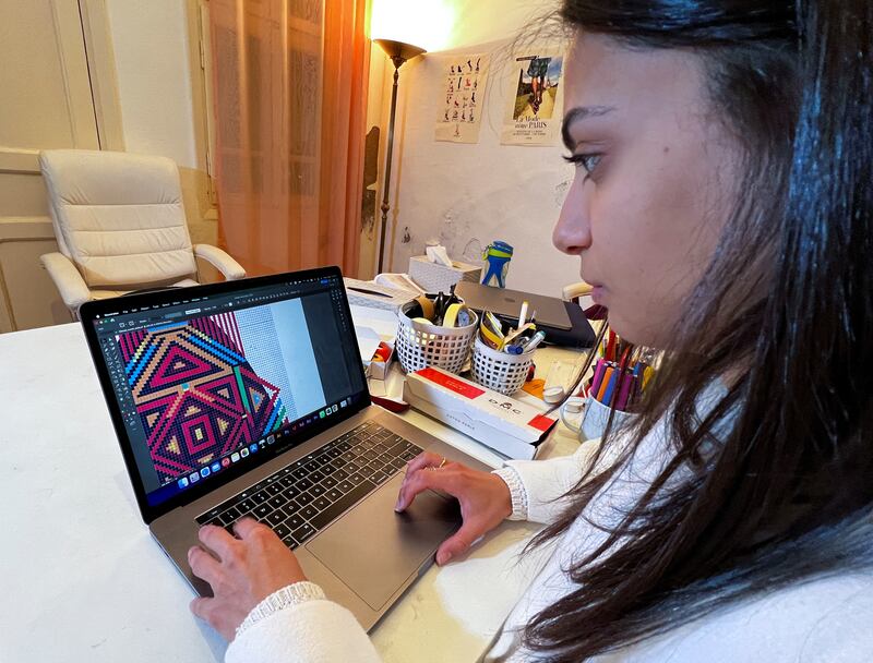 Yasmin Khatib, a designer at Gioia, works on her laptop.