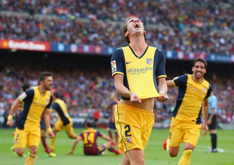 Diego Godin of Atletico Madrid celebrates after scoring his goal on Saturday against Barcelona. Alex Livesey / Getty Images / May 17, 2014