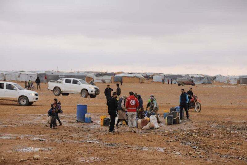 (FILES) In this file photo taken on November 03, 2018 In this handout photo released by the Syrian Arab Red Cross (SARC) Office in Syria on November 4, 2018, workers of the Syrian Arab Red Cross (SARC) deliver humanitarian aids in the Rukban desert camp for displaced Syrians along Syria's border with Jordan. The United Nations said on August 30, 2019, it will help evacuate civilians from an "abysmal" Syrian desert camp near the border with Jordan, after a mission last week determined who wanted to leave. -  == RESTRICTED TO EDITORIAL USE - MANDATORY CREDIT "AFP PHOTO / HO / Syrian Arab Red Cross (SARC)" - NO MARKETING NO ADVERTISING CAMPAIGNS - DISTRIBUTED AS A SERVICE TO CLIENTS ==
 / AFP / Syrian Arab Red Cross / HO /  == RESTRICTED TO EDITORIAL USE - MANDATORY CREDIT "AFP PHOTO / HO / Syrian Arab Red Cross (SARC)" - NO MARKETING NO ADVERTISING CAMPAIGNS - DISTRIBUTED AS A SERVICE TO CLIENTS ==
