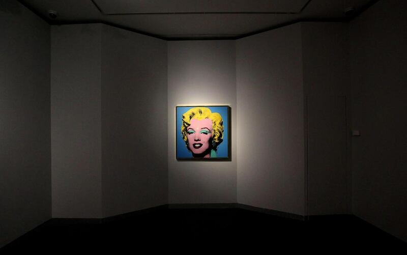 A portrait of Marilyn Monroe by Warhol is seen displayed at the exhibition. (Alessandro di Meo / EPA/ 16 April, 2014)