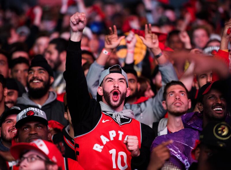 Toronto Raptors fans watch the broadcast of Game 6 of basketball's NBA Finals between the Raptors and the Golden State Warriors, at a viewing party outside Scotiabank Arena. AP Photo