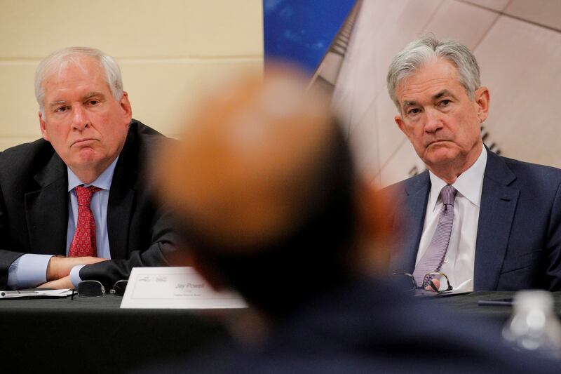 Eric Rosengren, left, seen with US Federal Reserve chairman Jerome Powell, resigned as Boston Fed chief last September after reports of active trading. Reuters