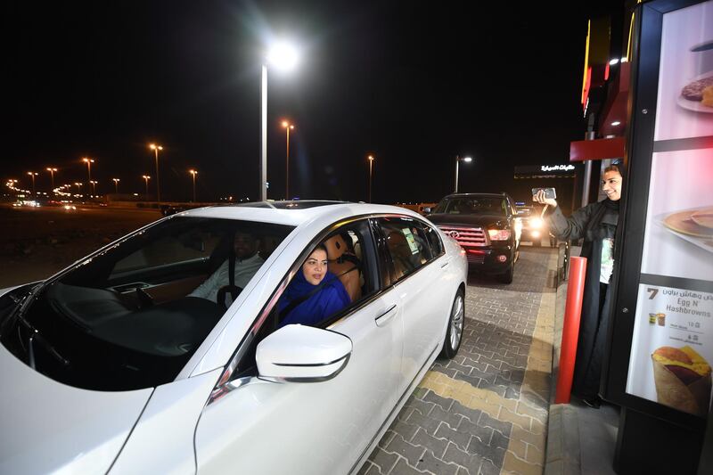 Saudi Samira Al-Ghamdi is seen in her car with family driving at a food court in the coastal city of Jeddah for the first time. Amer Hilabi / AFP