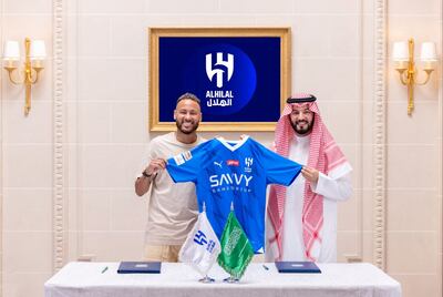Al Hilal's new signing Neymar with club chief Fahd bin Nafel. Reuters