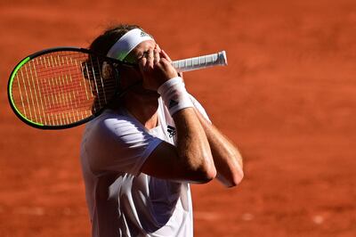 TOPSHOT - Greece's Stefanos Tsitsipas celebrates after winning against Germany's Alexander Zverev during their men's singles semi-final tennis match on Day 13 of The Roland Garros 2021 French Open tennis tournament in Paris on June 11, 2021. / AFP / MARTIN BUREAU
