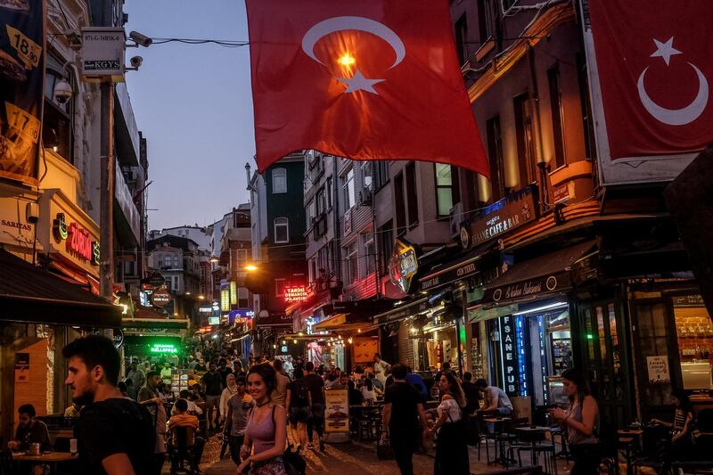 ISTANBUL, TURKEY - JULY 12:  People walk through a street full of restaurants and bars on July 12, 2018 in Istanbul Turkey. Following Turkey's President Recep Tayyip Erdogan's re-election victory and the appointment of his son-in-law Berat Albayrak to lead the Treasury and Finance Ministry fears are growing that Turkey's economy is heading into crisis . The Turkish Lira, has plunged by approximately  one-fifth this year raising prices for businesses and households.  (Photo by Chris McGrath/Getty Images)